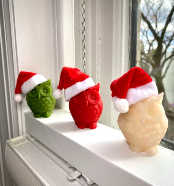 Owl candles with Santa hats